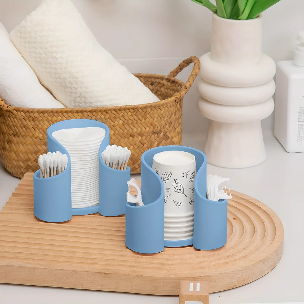 A modern plastic dental floss storage box in a solid colour, shown with colour options: pink, white, blue, black.