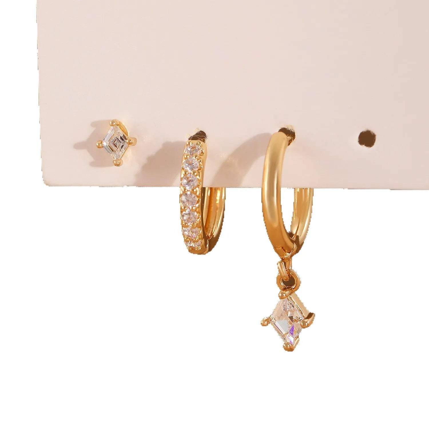 Ladies three-piece jewellery set with geometric designs and inlaid zircon stones in gold and silver colours