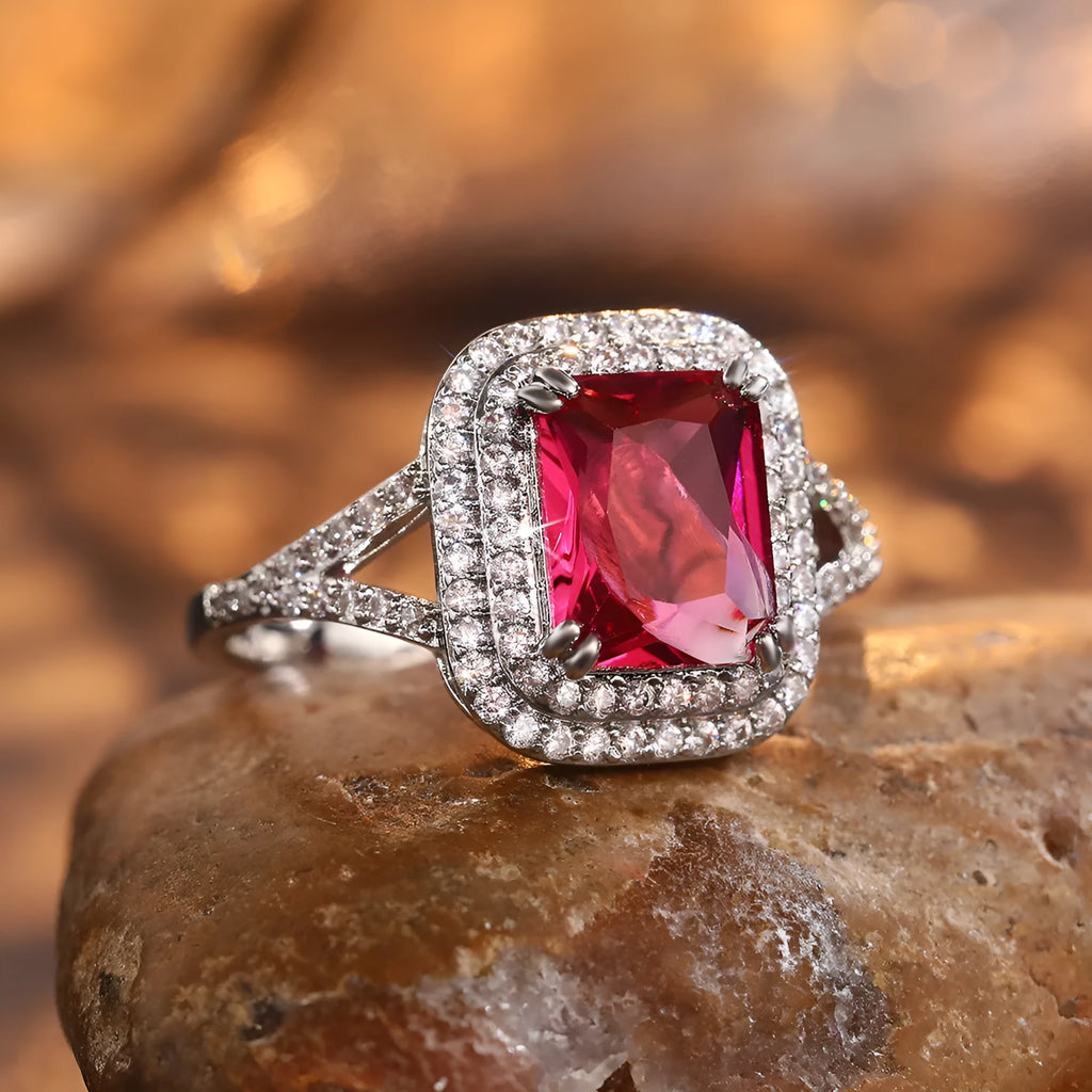 Red copper square women's ring with a central rhinestone on a model's hand.