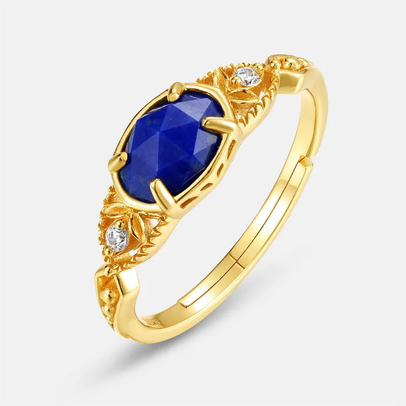 Women's sterling silver ring with a blue lapis lazuli stone in an ellipse shape.