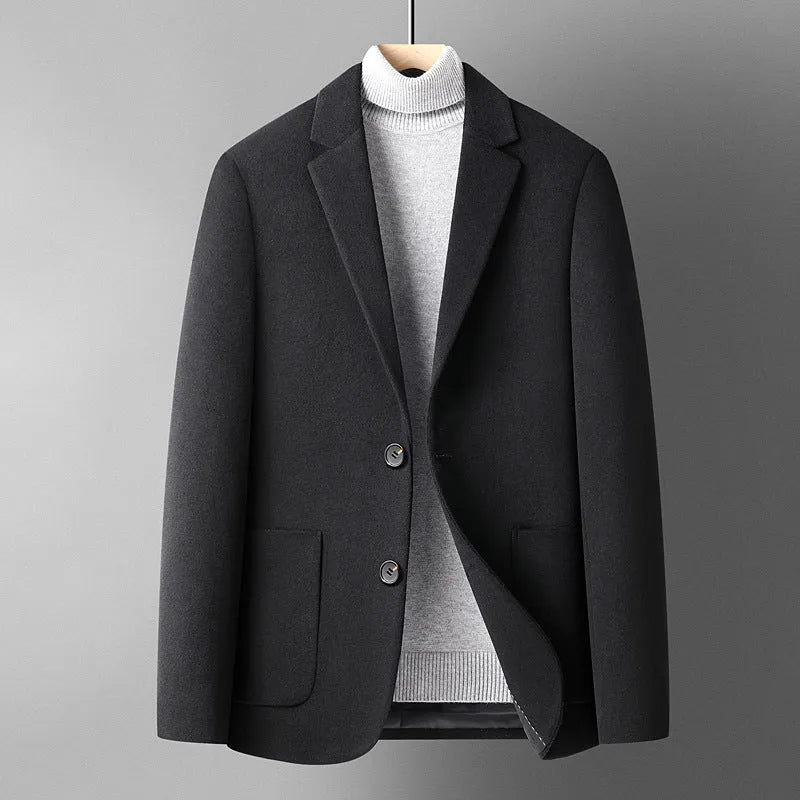 Slim fit men's wool suit jacket in grey, shown on a hanger.