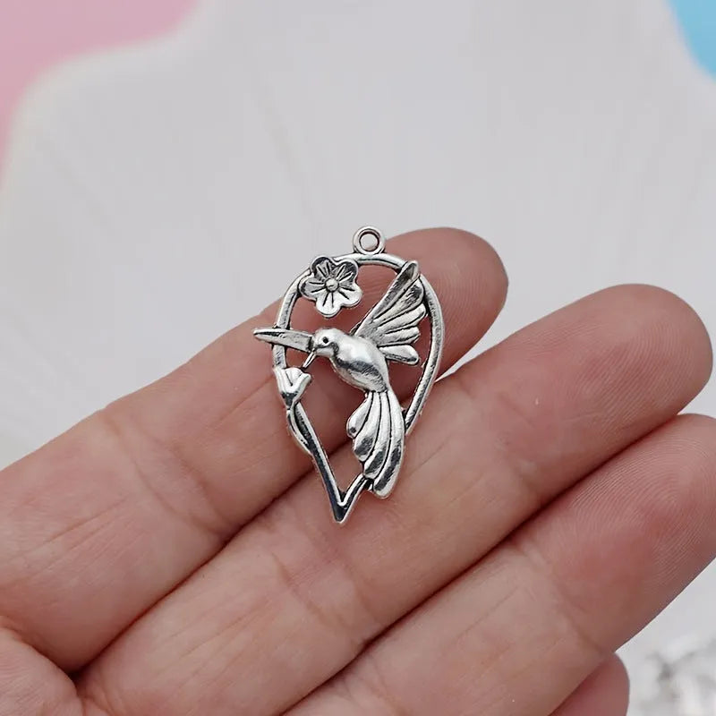 Alloy magpie pendant charm with electroplated finish in colour P234 for DIY jewellery crafting.