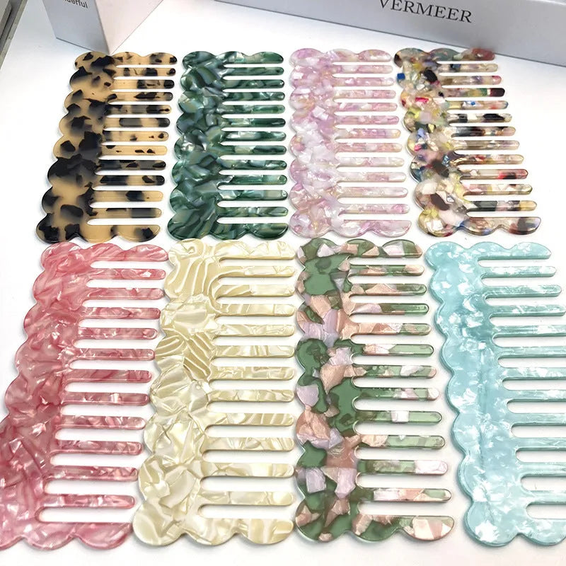 Acetate board hair comb with geometric wave design in a selection of colours.