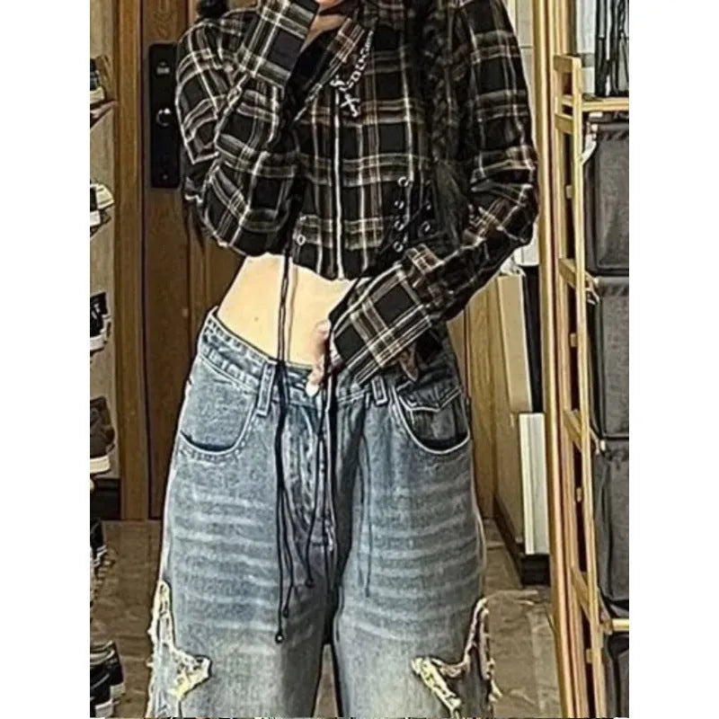 Blue high waist straight leg women's jeans on a hanger.