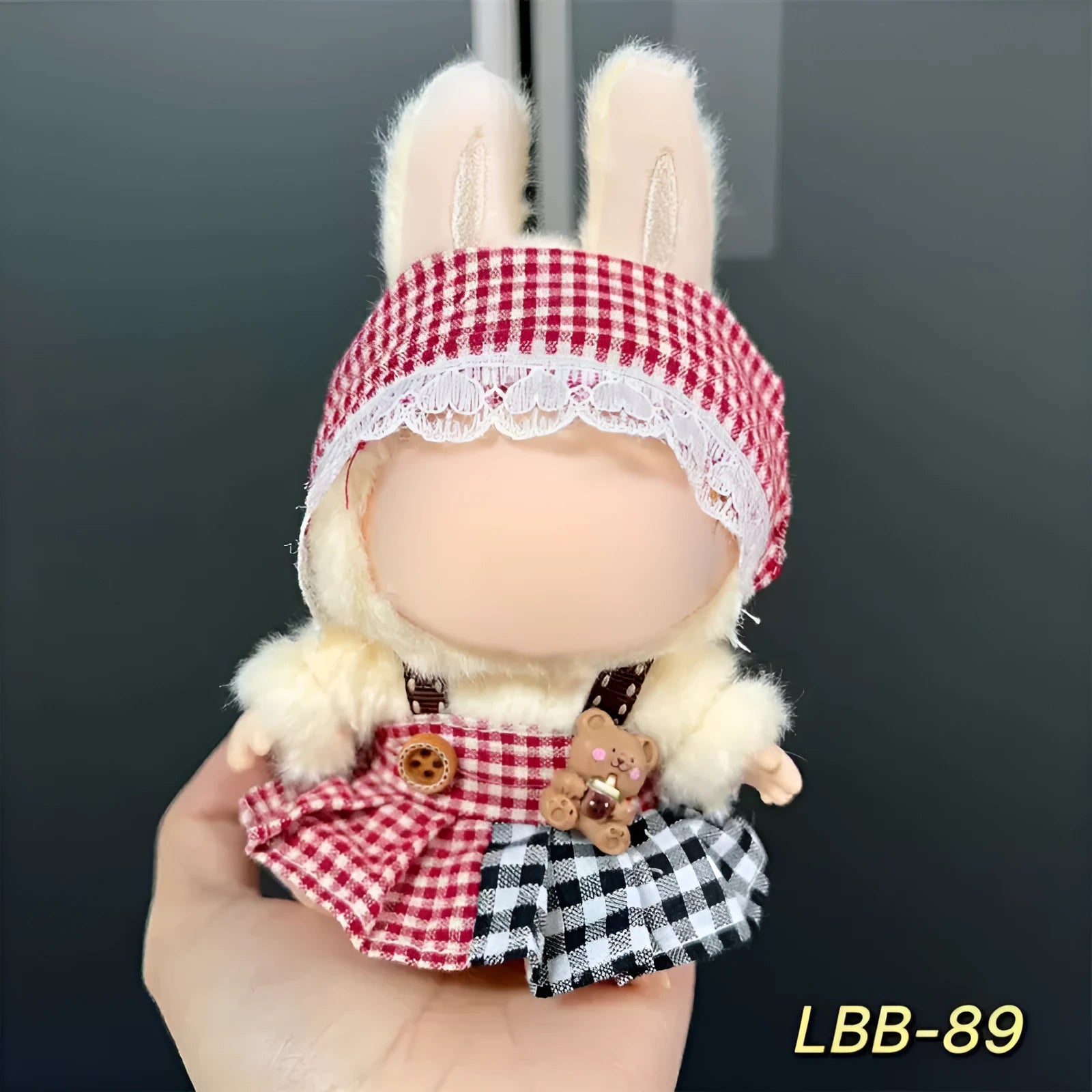 Plastic doll costume for a 17cm tall vinyl figurine on a white background.