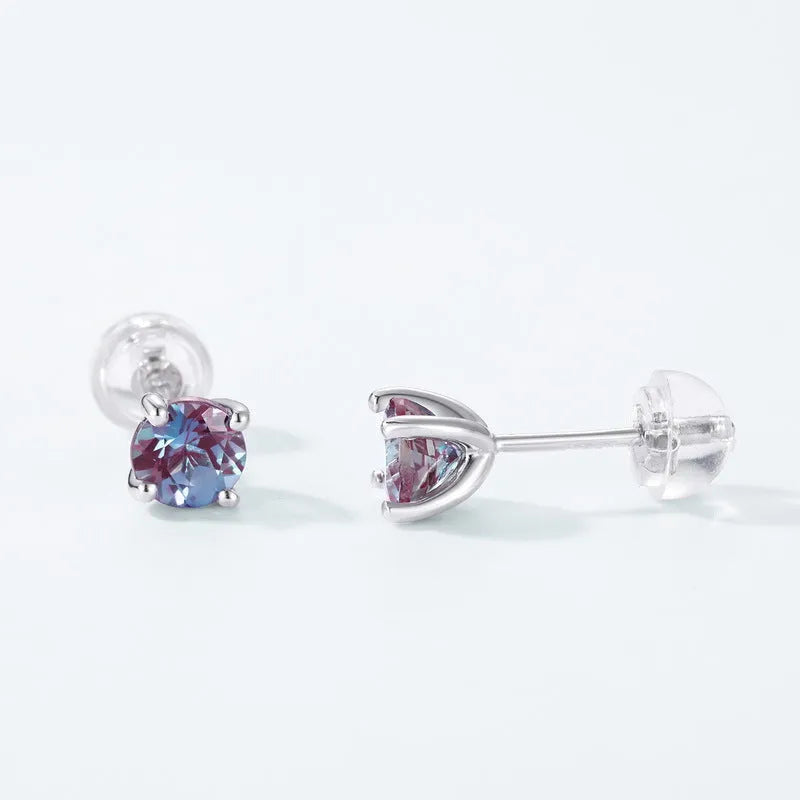Simple geometric silver ear studs with a round Cultivate Alexandrite stone.