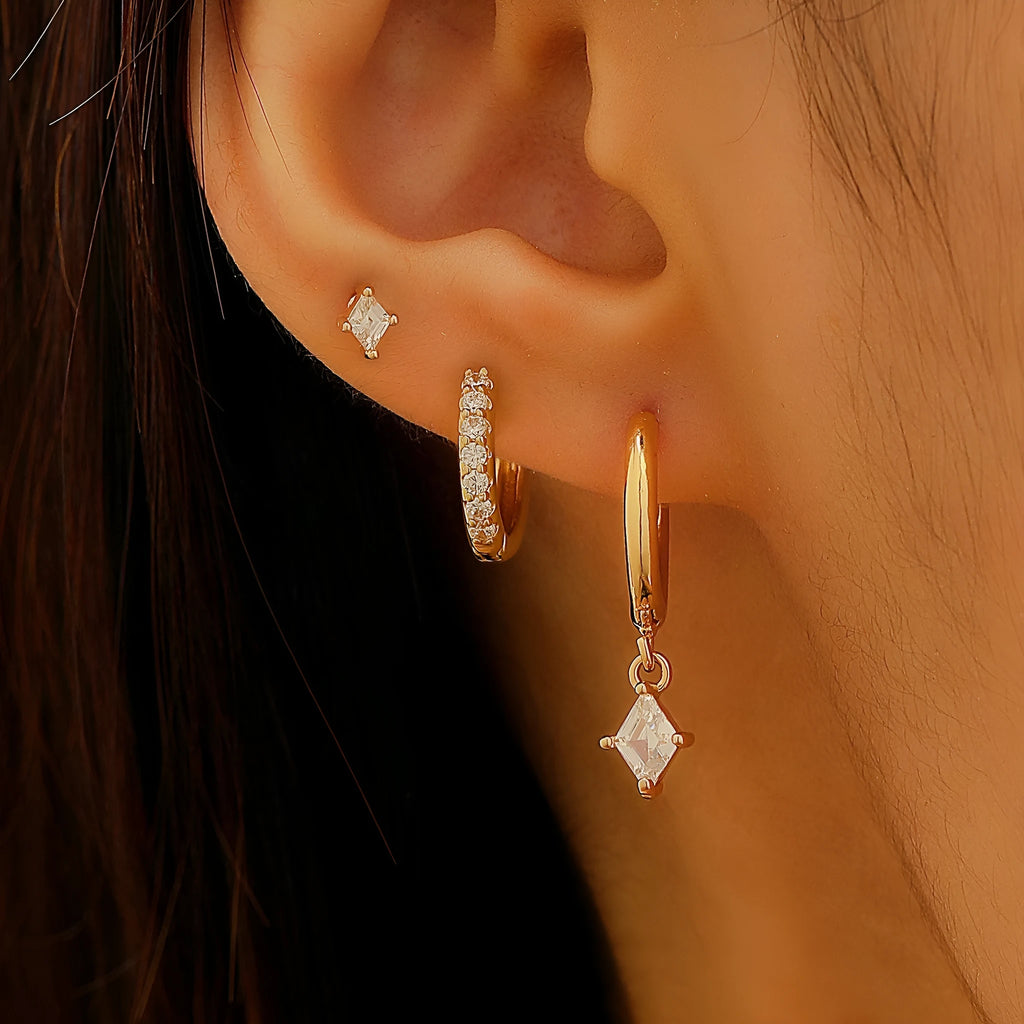 Ladies three-piece jewellery set with geometric designs and inlaid zircon stones in gold and silver colours