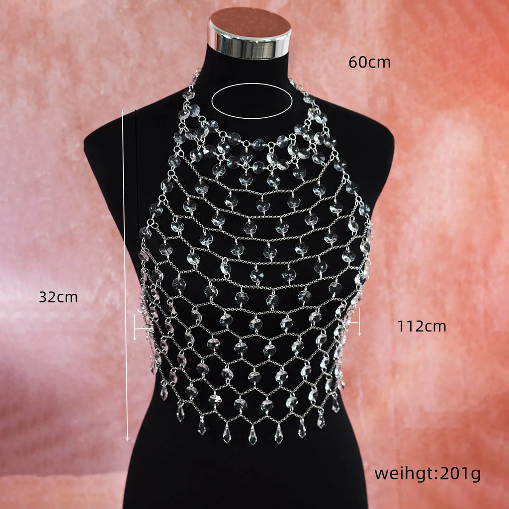 Hand-woven transparent acrylic sequinned plastic resin body chain draped flat.