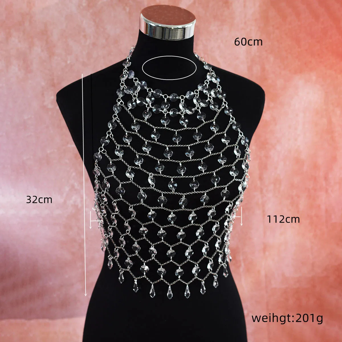Hand-woven transparent acrylic sequinned plastic resin body chain draped flat.