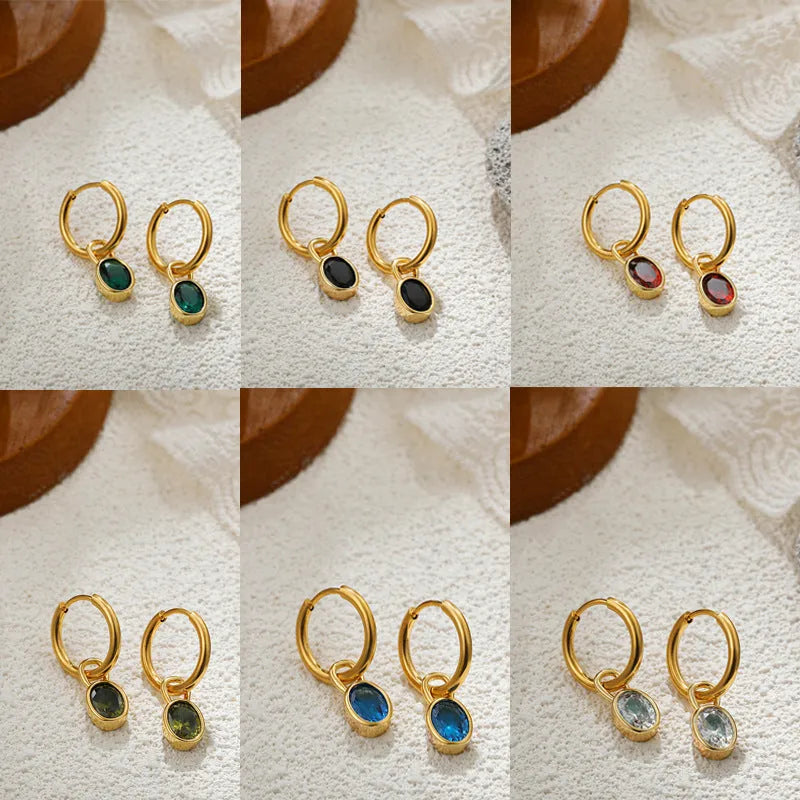 A pair of women's retro-style oval zircon stud earrings in copper, showing one of the six available stone colour options.