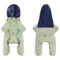 Small to medium sized dog wearing a khaki coloured waterproof polyester shell jacket.