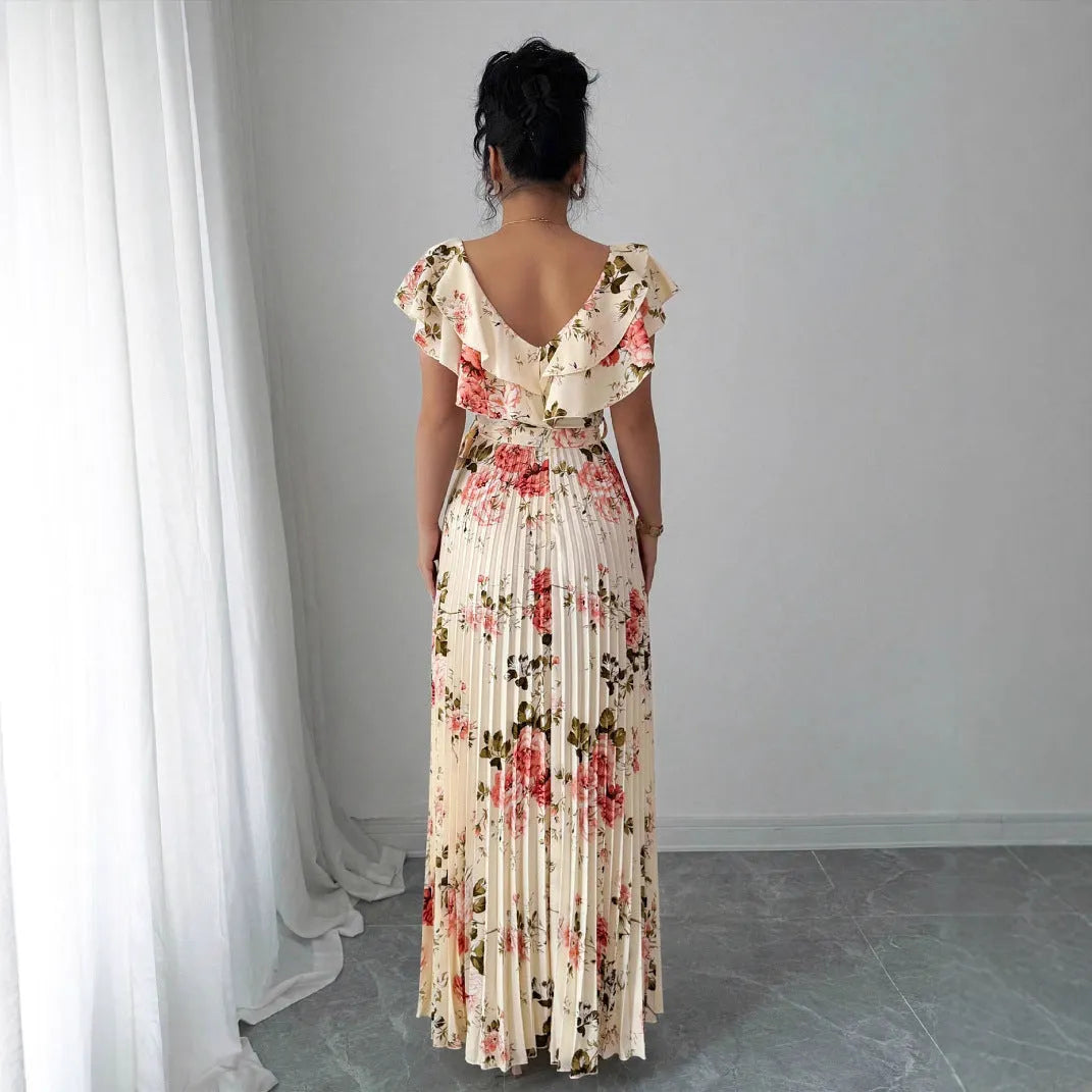 Apricot floral print women's dress with v-neck, ruffled short sleeves, and a high-waisted pleated swing skirt.