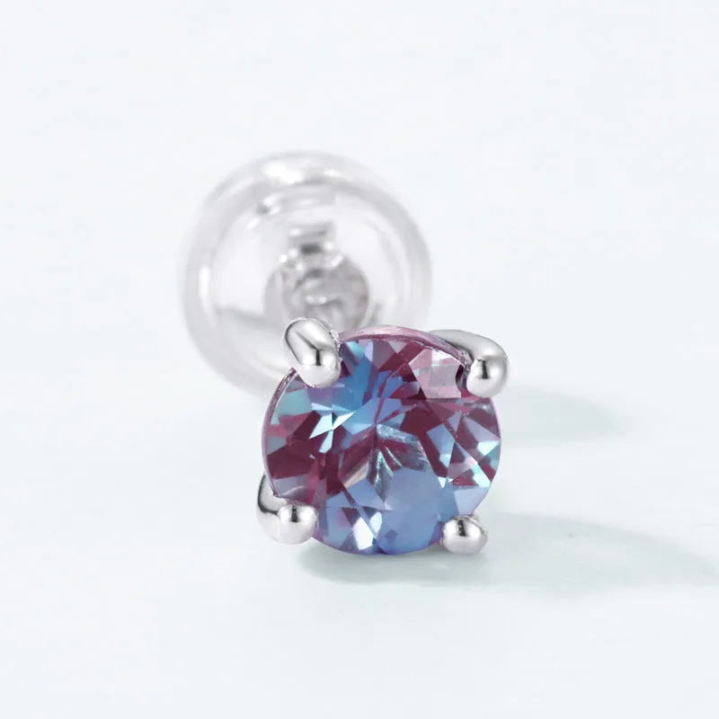 Simple geometric silver ear studs with a round Cultivate Alexandrite stone.