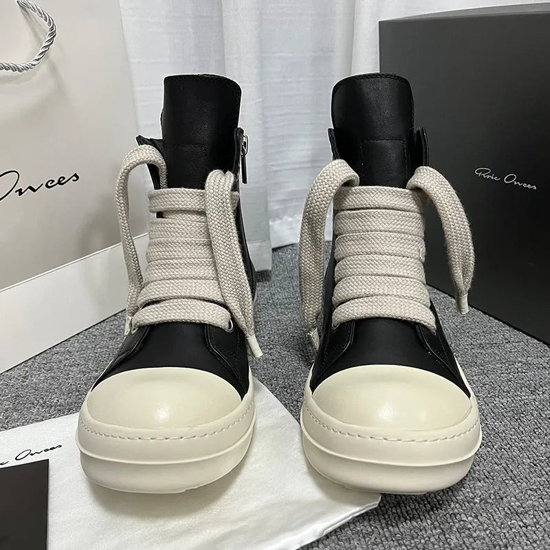 Genuine leather high-top sneakers with side zipper in black, shown on a white background.