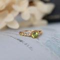 Copper ring with green quadrilateral imitation peridot stone in a Japanese retro geometric design