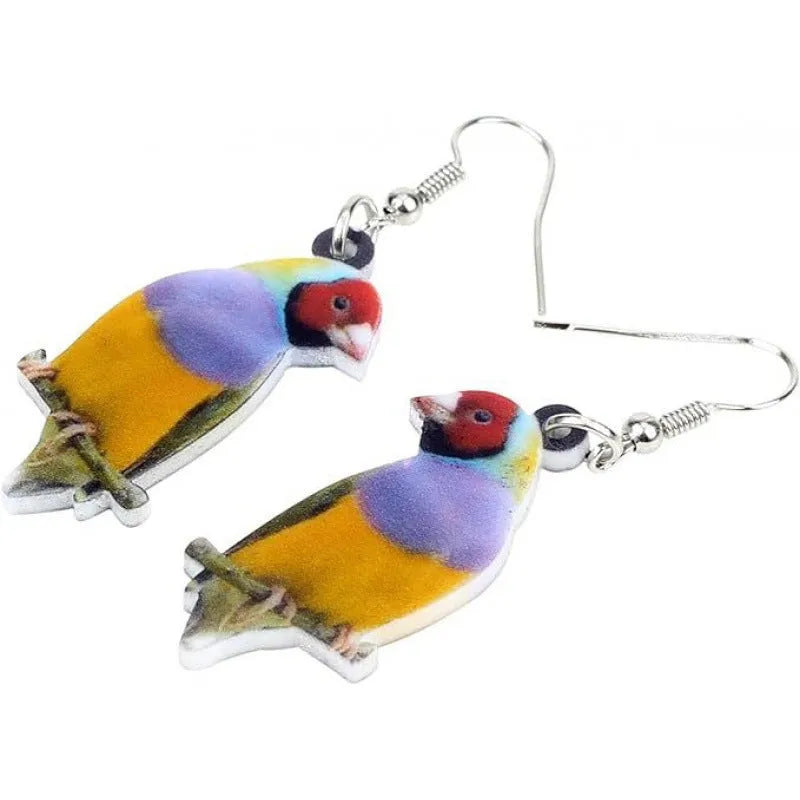 A pair of blue titmouse pendant earrings with printed design on acrylic, featuring geometric and snake elements.