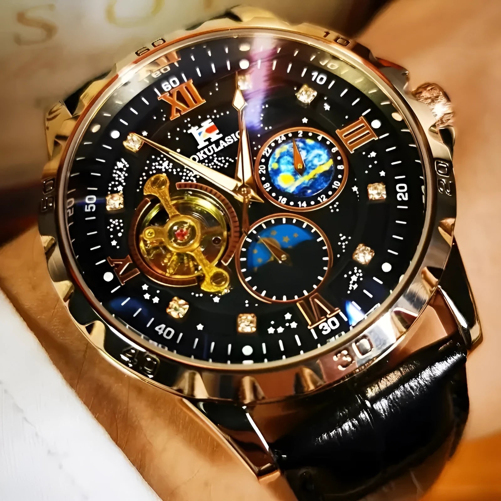 Men's black and rose gold automatic skeleton watch on a leather strap
