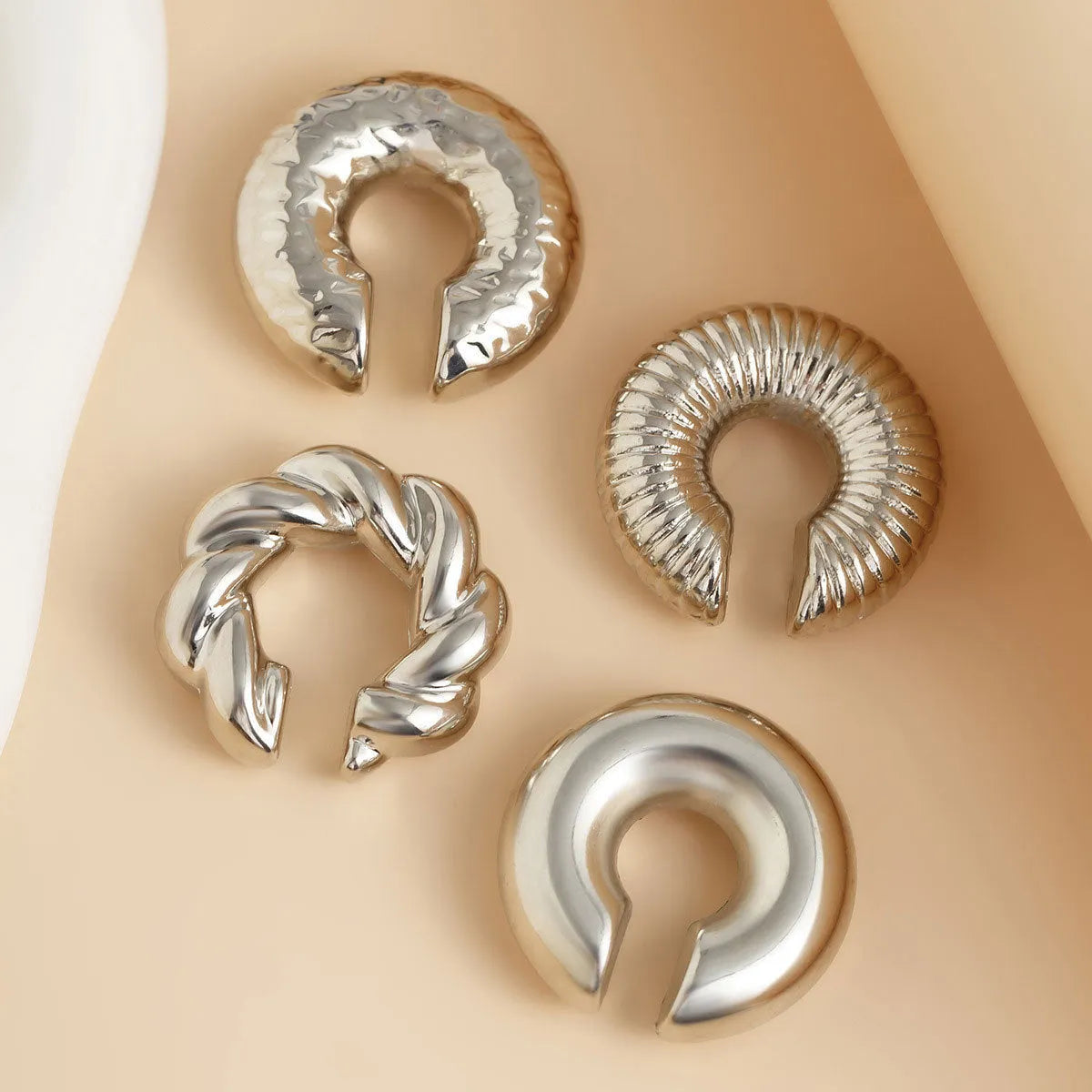 Geometric ear clips set in gold and silver colours for women without pierced ears