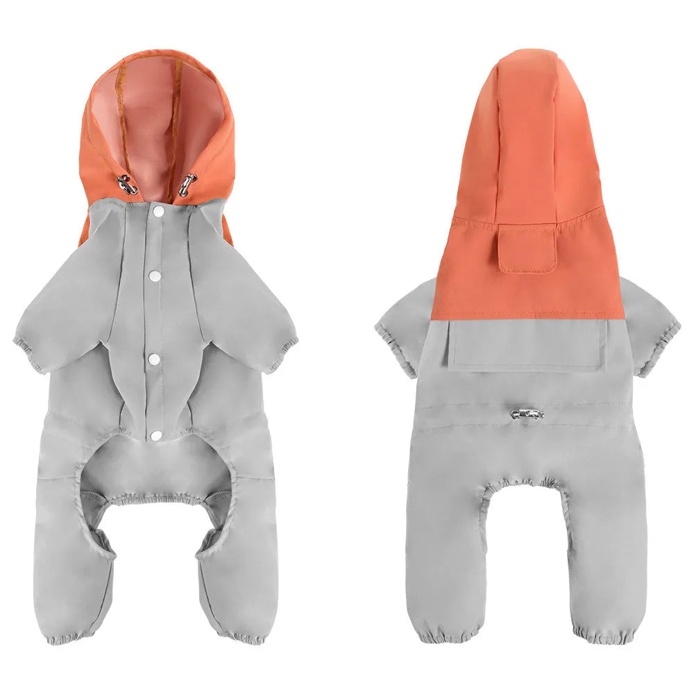 Small to medium sized dog wearing a khaki coloured waterproof polyester shell jacket.