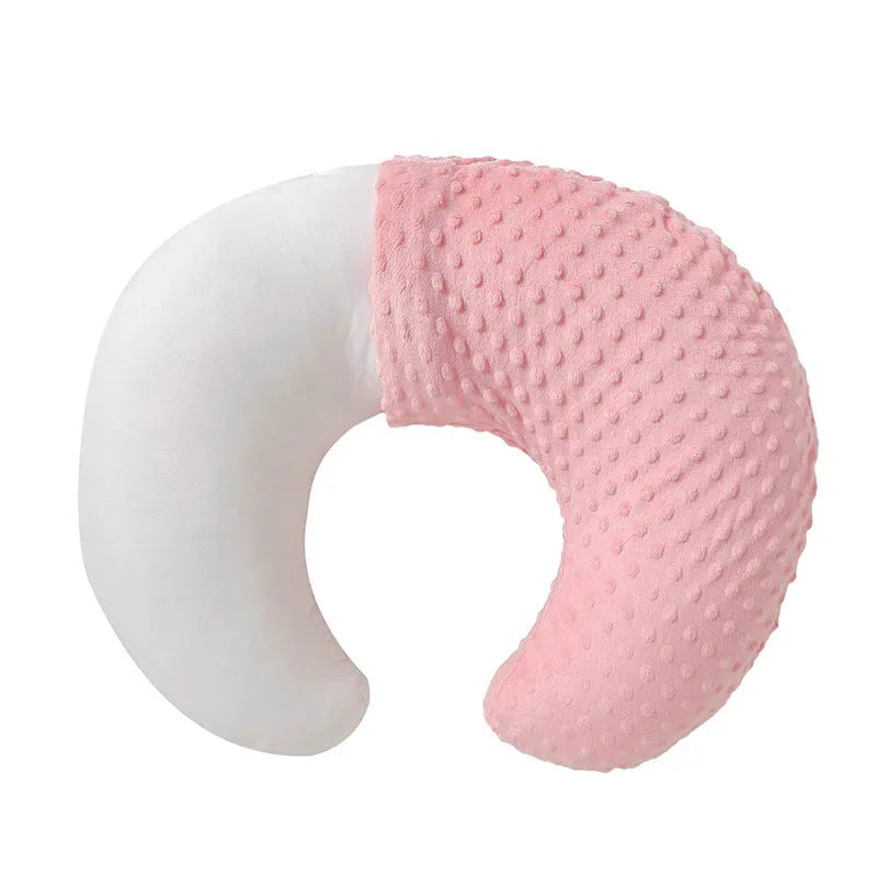 Multifunctional nursing pillow with a raised spill-prevention ridge in a light blue colour.