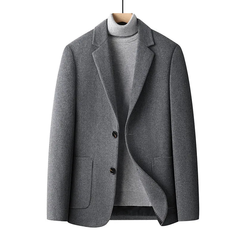 Slim fit men's wool suit jacket in grey, shown on a hanger.