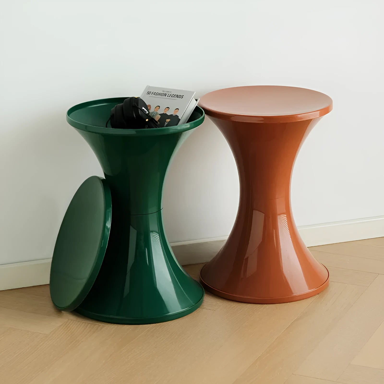 Creative hourglass-shaped plastic stool for changing shoes, shown in a green colour.