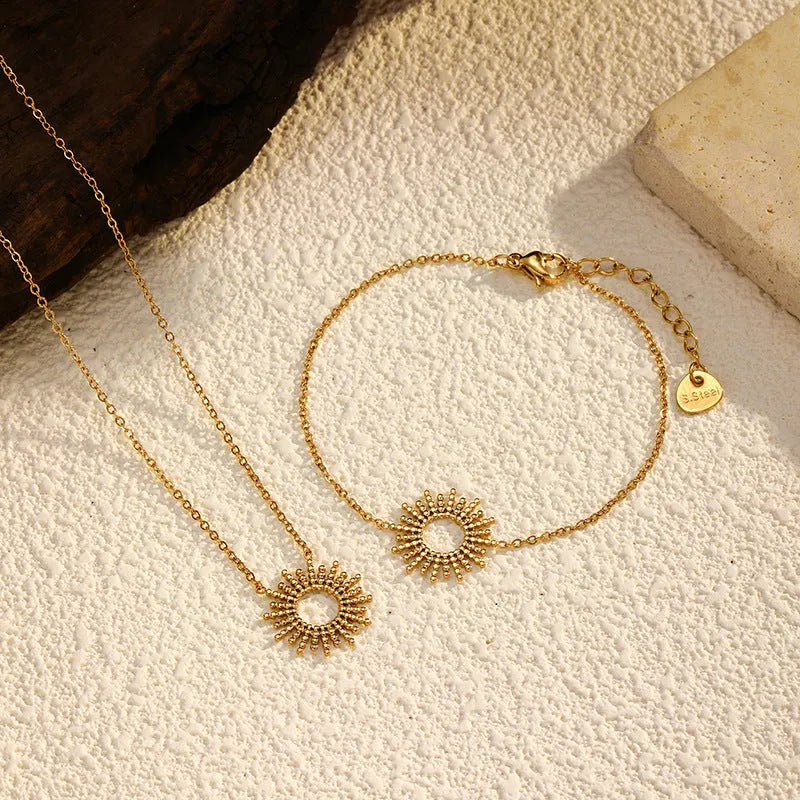 Gold tone geometric chain necklace and bracelet jewellery set for women