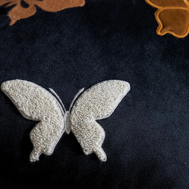 Square beige cushion with detailed Chinese butterfly embroidery design.