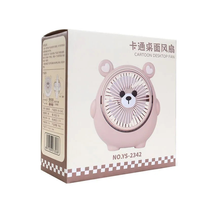 Cute dog-themed USB desktop electric fan on a wooden desk, showing three-speed buttons and a light pink puppy design.