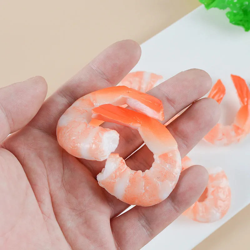 PVC shrimp-shaped keychain with metal door buckle, showing detailed crustacean design.