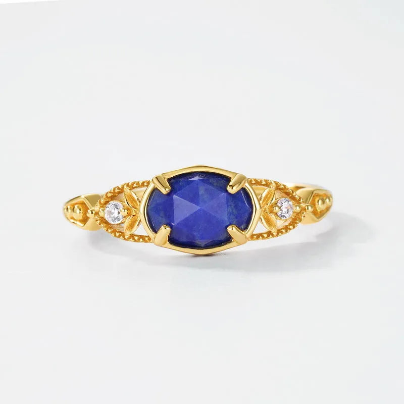 Women's sterling silver ring with a blue lapis lazuli stone in an ellipse shape.
