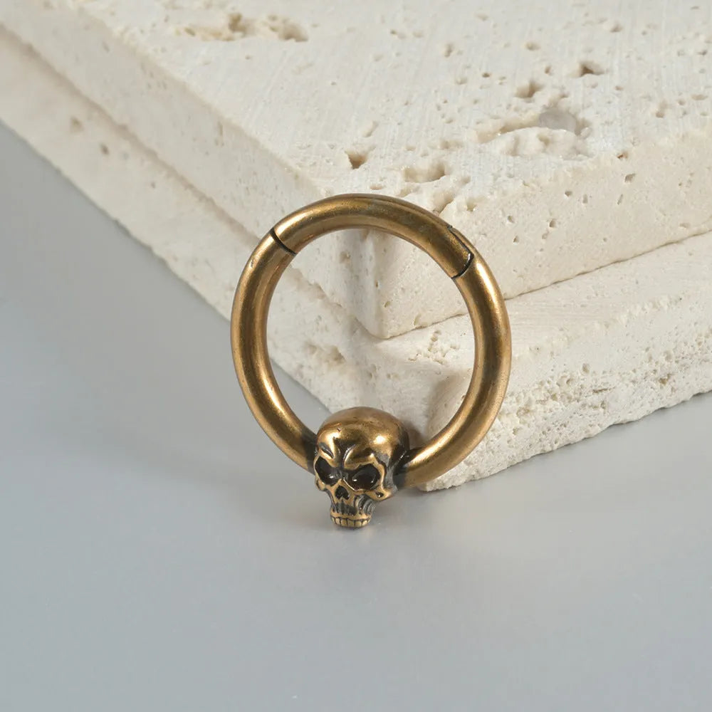 Copper ghost head punk earrings in ancient silver or gold finish with single or triple design