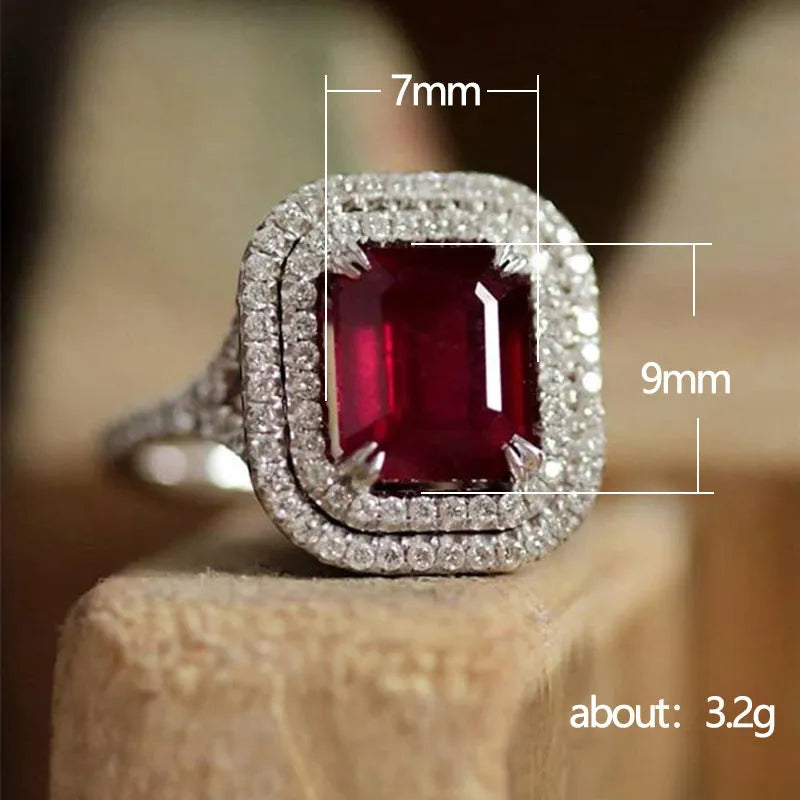 Red copper square women's ring with a central rhinestone on a model's hand.