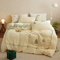 Winter-themed milk fibre bedding set with Christmas tree print on quilt cover and pillowcases.