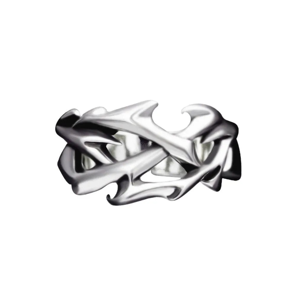 Copper adjustable ring with geometric thorn and flower design on a hand.