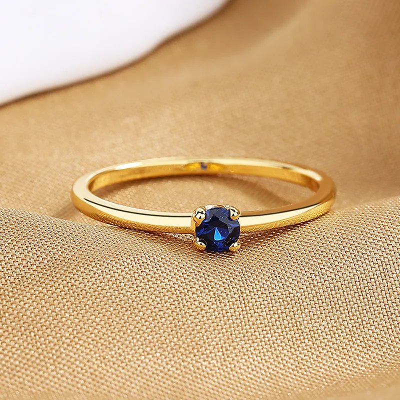 Geometric copper ring with single diamond in white red green blue colours for women sizes 6-9