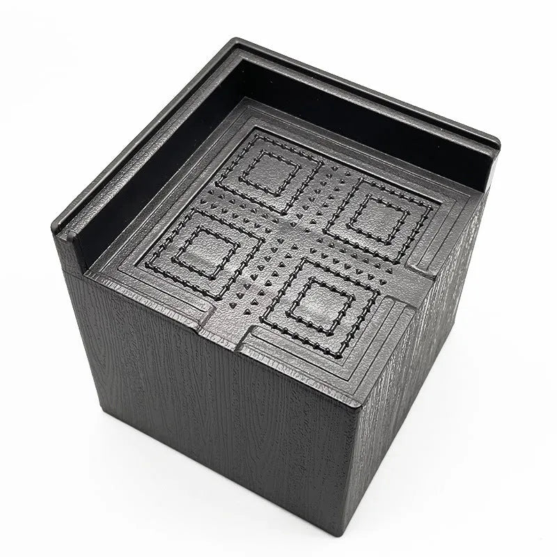Four black plastic furniture riser mats for bed and sofa feet height adjustment