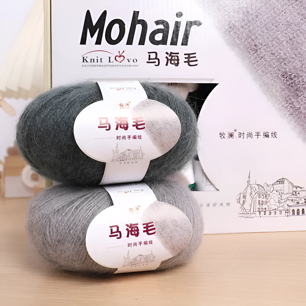A ball of mohair yarn in a selected colour next to a hand-woven scarf example, showcasing the DIY kit.