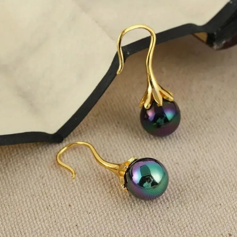 Gold retro style women's fashion earrings with creative design