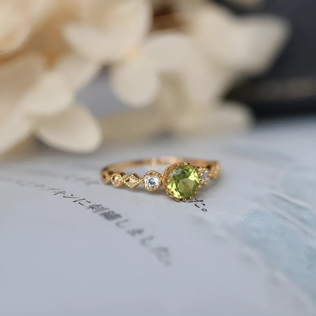Copper ring with green quadrilateral imitation peridot stone in a Japanese retro geometric design