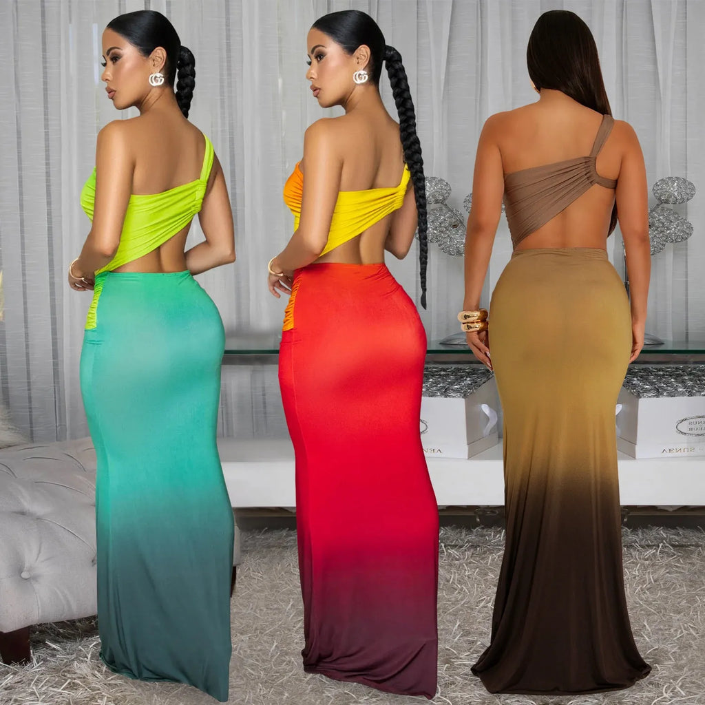 Brown gradient sleeveless dress with cross-shoulder straps and a long skirt on a model.