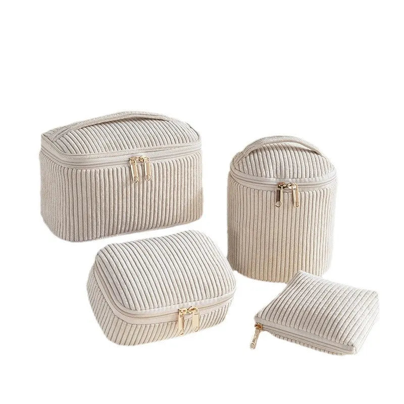 Four cube-shaped flannelette makeup bags in a set, showing pink dots and solid colour options.