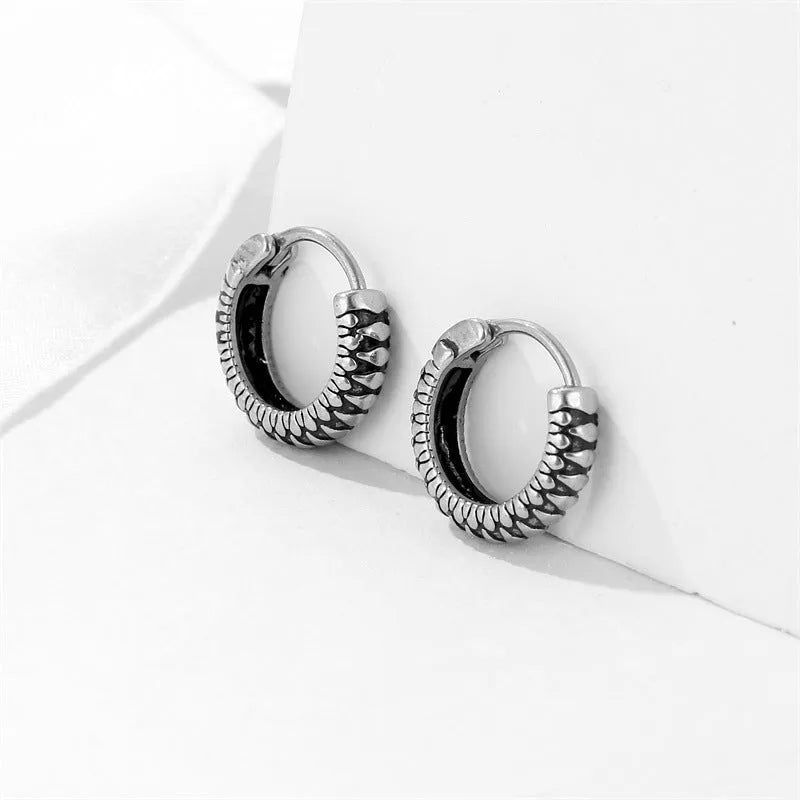 Silver geometric alloy earrings with retro twist design and striped sports-style elements