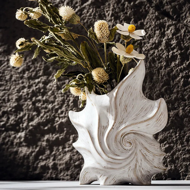 French-style retro ceramic vase with coloured glaze in a European decorative design.