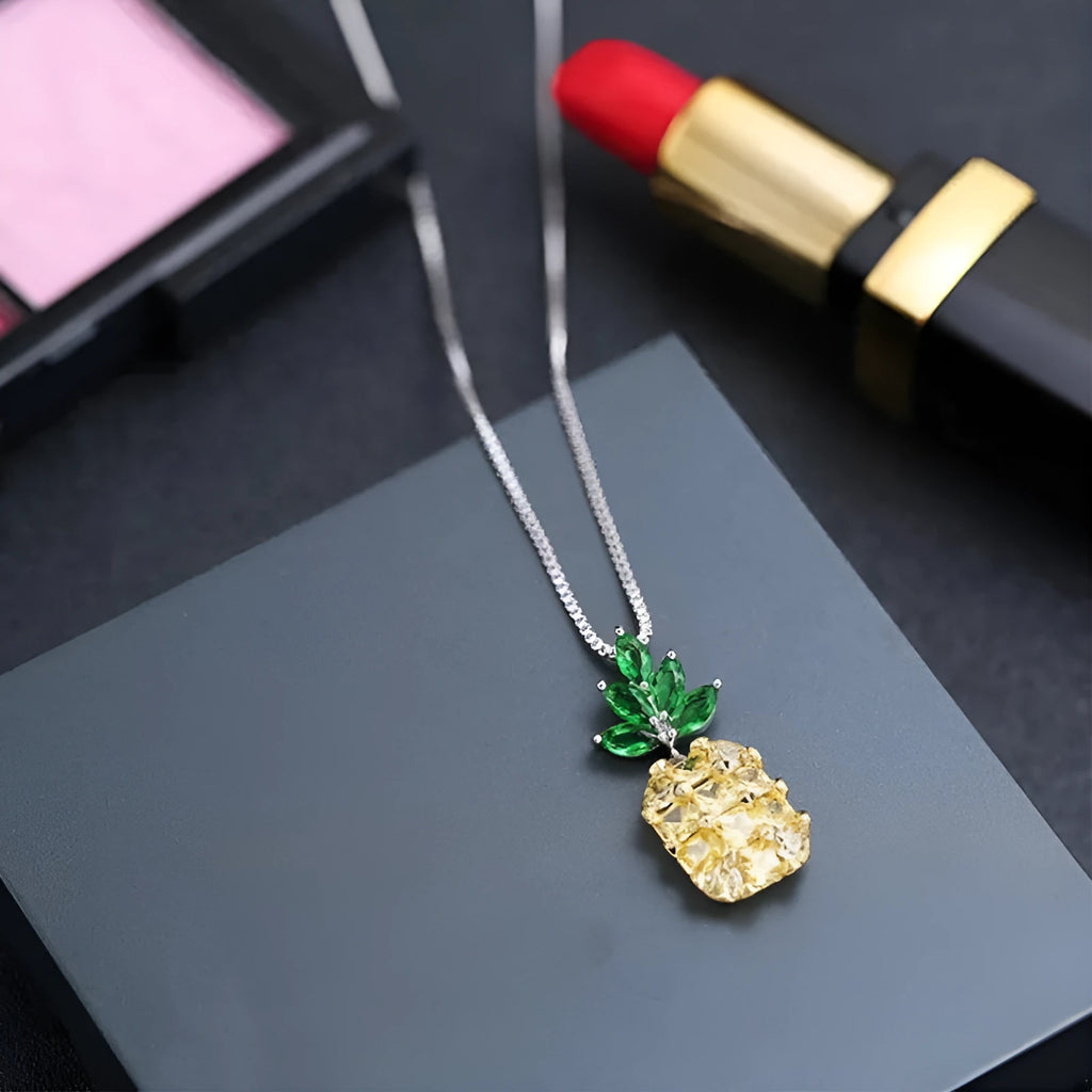 Silver geometric pineapple fruit pendant on a women's fashion necklace.