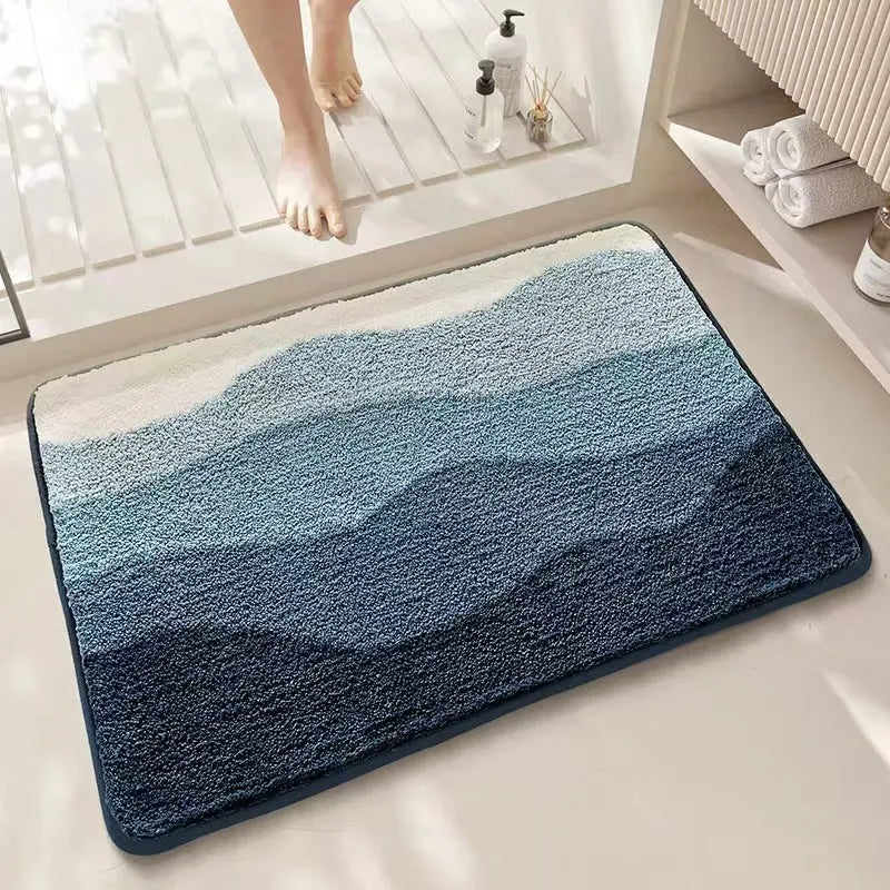Square Sky Sea rainbow pattern cashmere-effect floor mat with a plastic anti-slip backing.