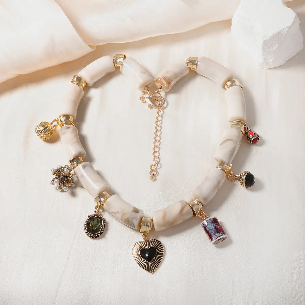 Resin bamboo necklace with heart-shaped pendant and electroplated finish
