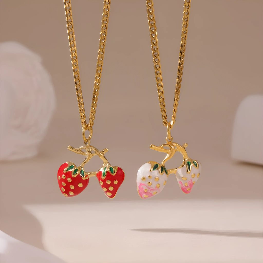 Women's strawberry fruit pendant necklace in red and white gradient colours on an alloy chain.