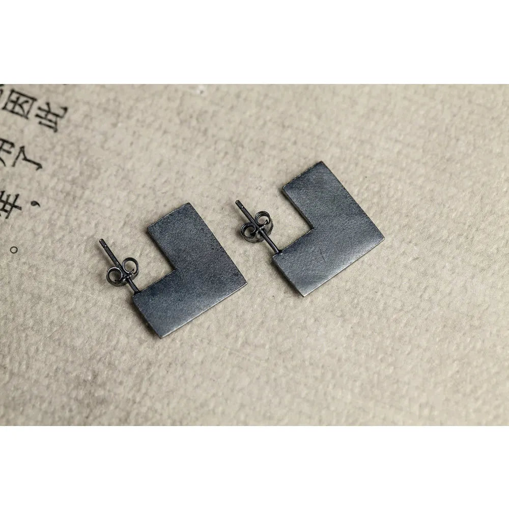 Oxidised black geometric square sterling silver earrings on a 16mm scale.
