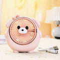 Cute dog-themed USB desktop electric fan on a wooden desk, showing three-speed buttons and a light pink puppy design.